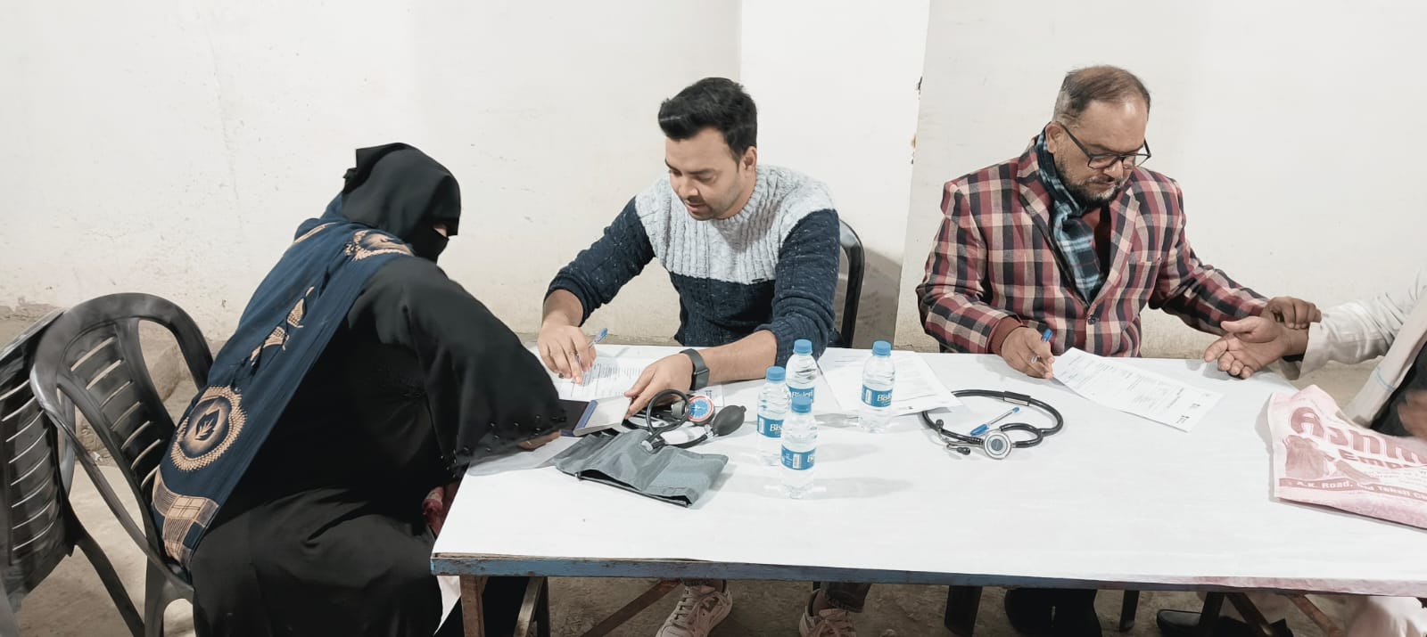 Doctor treating elderly patients